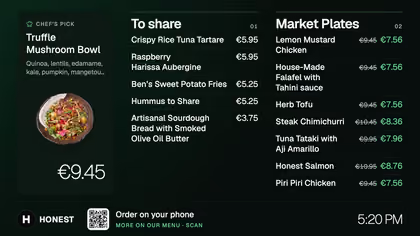 A menu board with dishes and prices