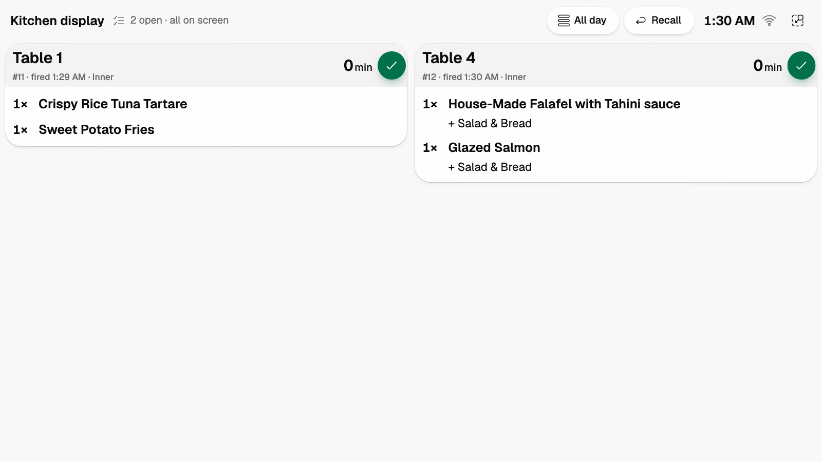 The kitchen display: tickets for table 1 and table 4, each with a Done button