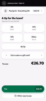 Paying the table’s bill on a phone, with a tip