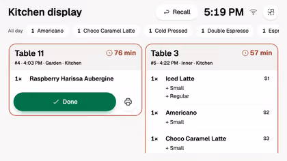 The kitchen display with tickets by table